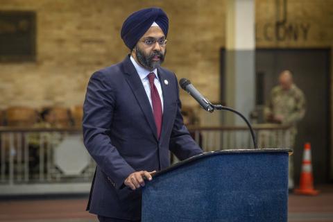 Gurbir Grewal addresses an audience